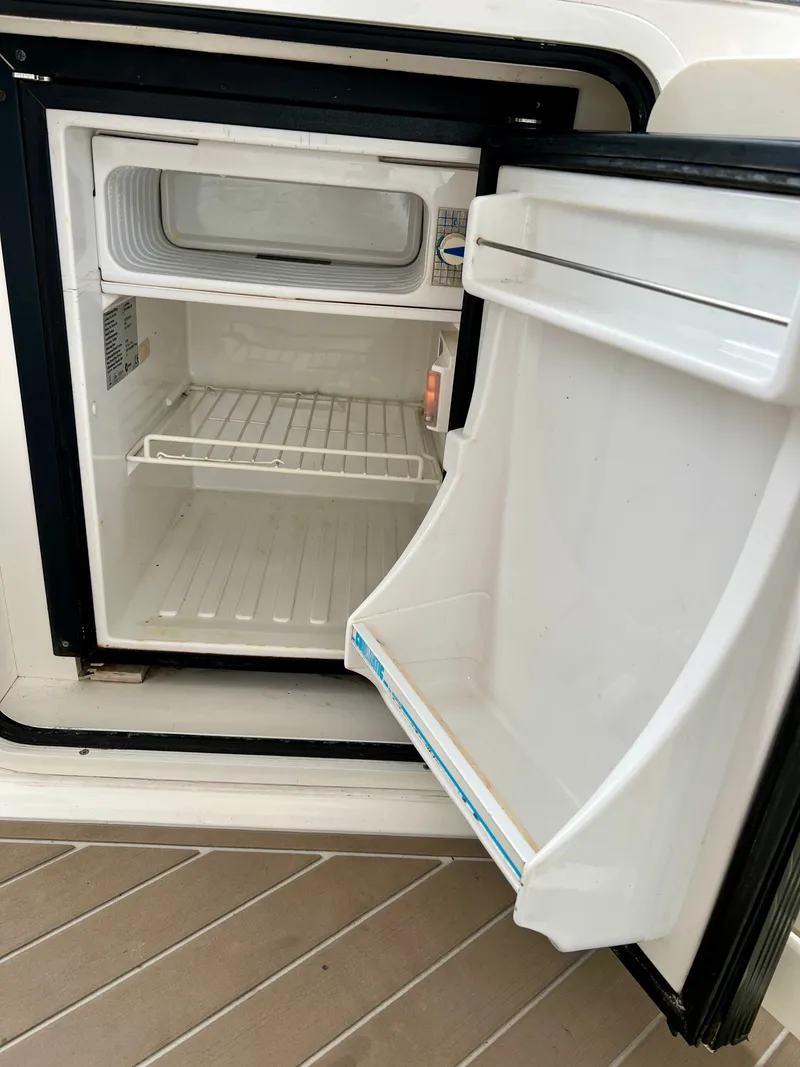 Slide: The Image of Open refrigerator on a 2007 Sea Ray 52 Sedan Bridge yacht. - 36