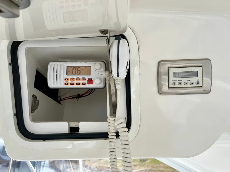 Slide: The Image of Radio and control panel on 2007 Sea Ray 52 Sedan Bridge. - 41