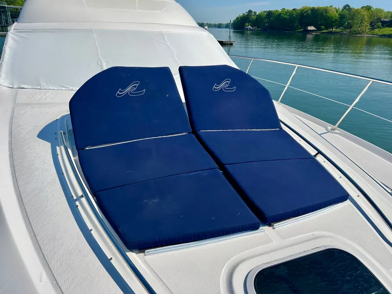 Slide: The Image of 2007 Sea Ray 52 Sedan Bridge with blue sun loungers. - 43