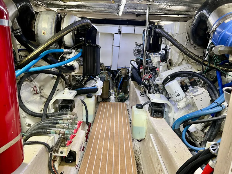Slide: The Image of Engine room of 2007 Sea Ray 52 Sedan Bridge with technical details. - 46