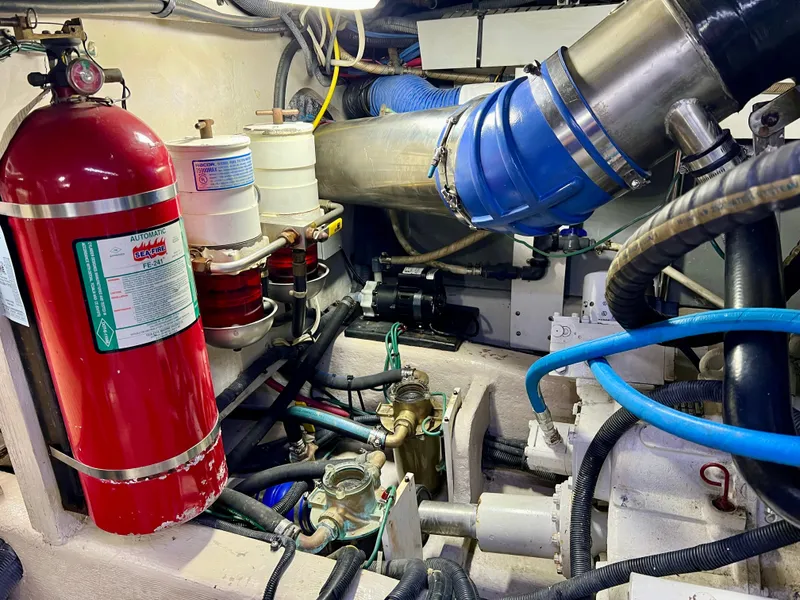 Slide: The Image of Engine room of 2007 Sea Ray 52 Sedan Bridge with fire extinguisher. - 48