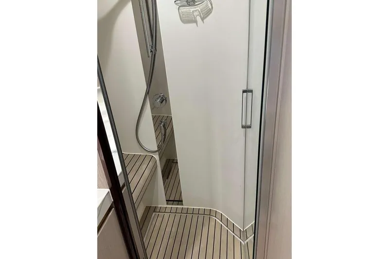 Slide: The Image of Shower area in 2021 Azimut Fly 60 yacht with sleek design and wooden flooring. - 13