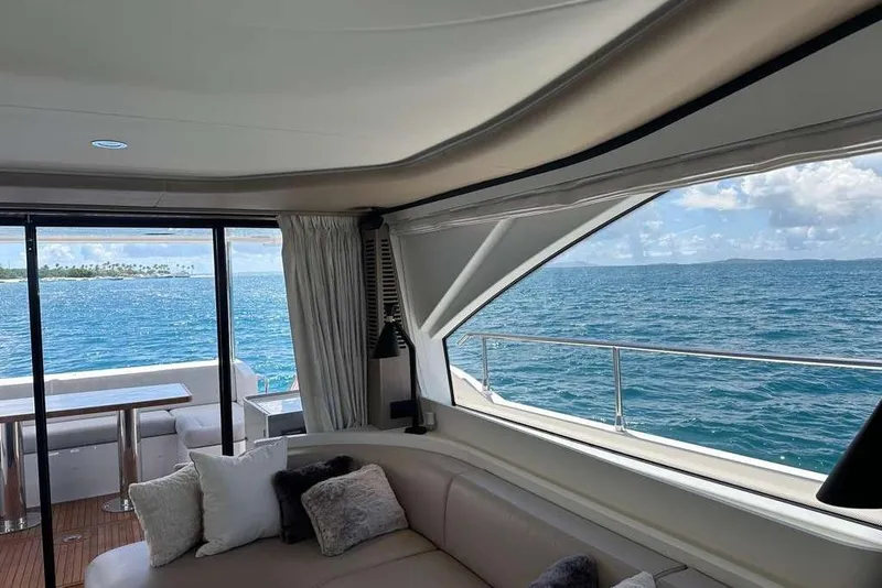 Slide: The Image of Interior view of 2021 Azimut Fly 60 yacht with ocean scenery through windows. - 2