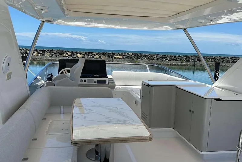 Slide: The Image of Luxurious 2021 Azimut Fly 60 yacht interior with elegant seating and ocean view. - 23