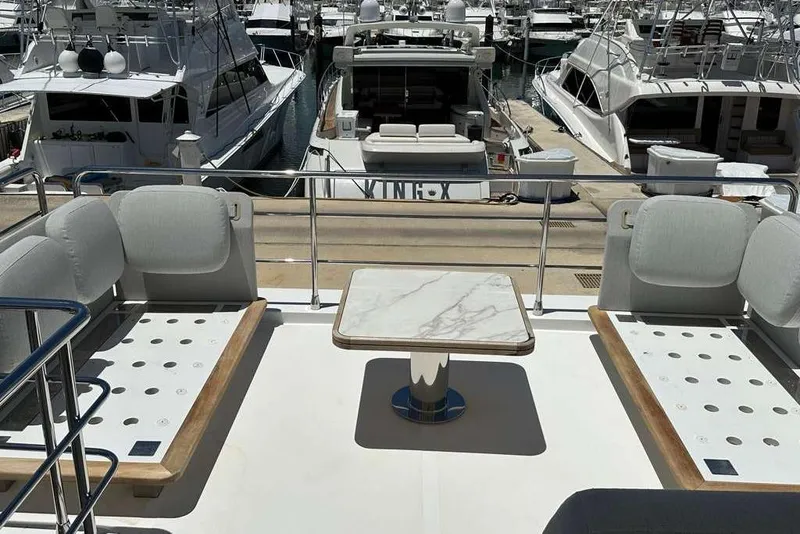 Slide: The Image of Luxurious 2021 Azimut Fly 60 yacht deck with elegant seating and marble table. - 24