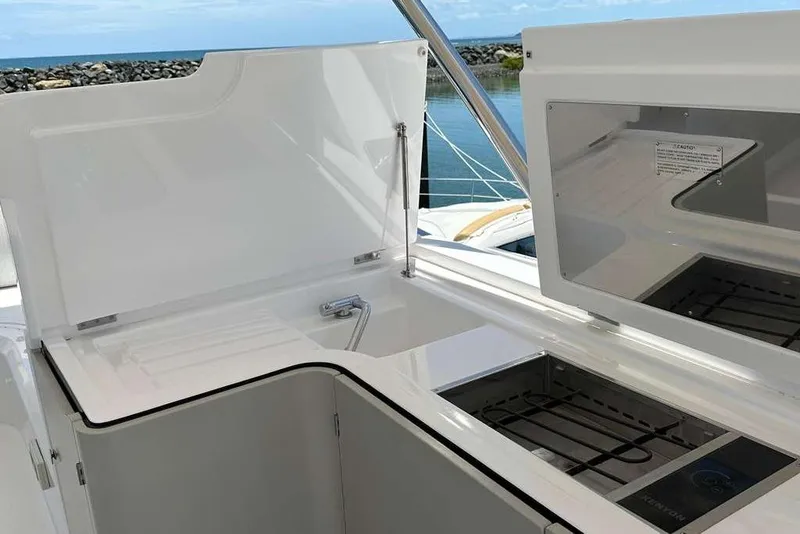 Slide: The Image of Open deck storage on 2021 Azimut Fly 60 yacht with ocean view. - 26