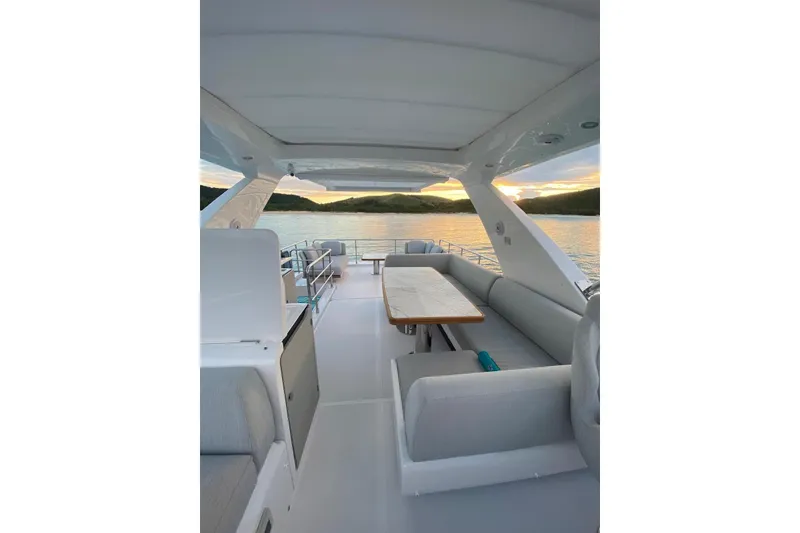Slide: The Image of Luxurious 2021 Azimut Fly 60 yacht interior with sunset view over calm waters. - 29
