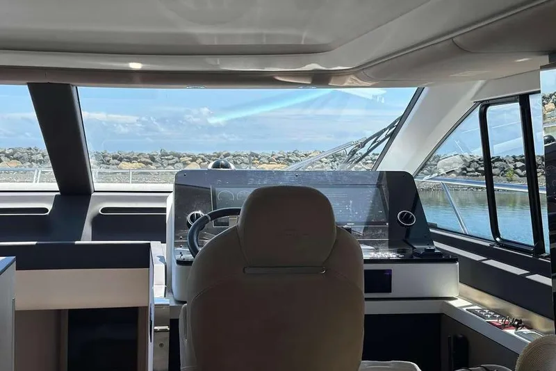 Slide: The Image of Interior view of 2021 Azimut Fly 60 yacht cockpit with scenic ocean backdrop. - 8