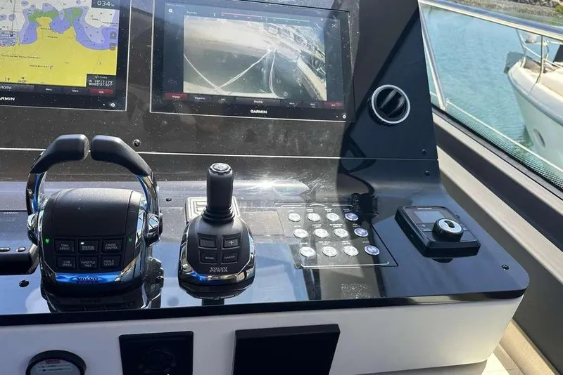 Slide: The Image of Control panel of a 2021 Azimut Fly 60 yacht with navigation screens. - 9