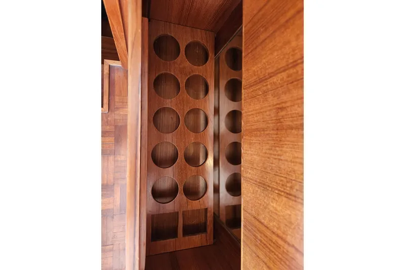 Slide: The Image of Wooden wine rack inside 1987 Jefferson 42 SE Sundeck Motor Yacht. - 19