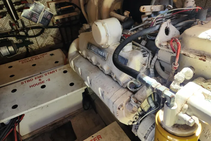 Slide: The Image of Engine room of a 1987 Jefferson 42 SE Sundeck Motor Yacht, showing mechanical components. - 44