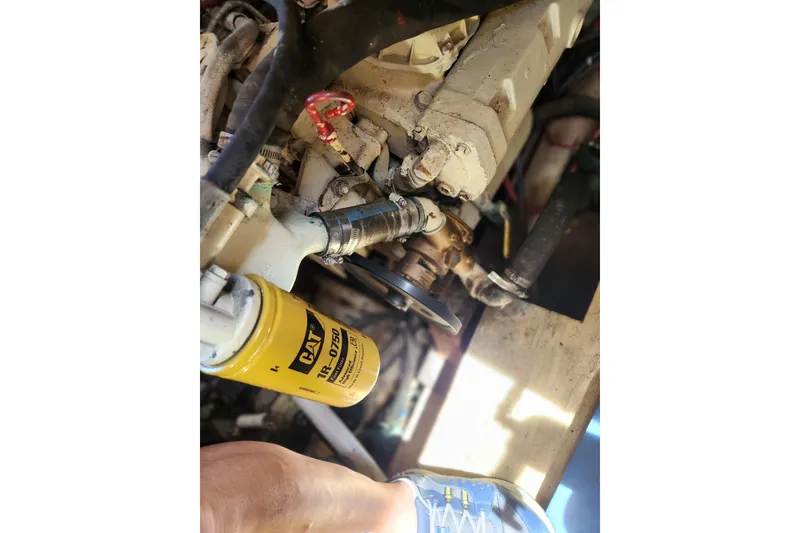 Slide: The Image of Engine compartment of 1987 Jefferson 42 SE Sundeck Motor Yacht with CAT filter visible. - 45