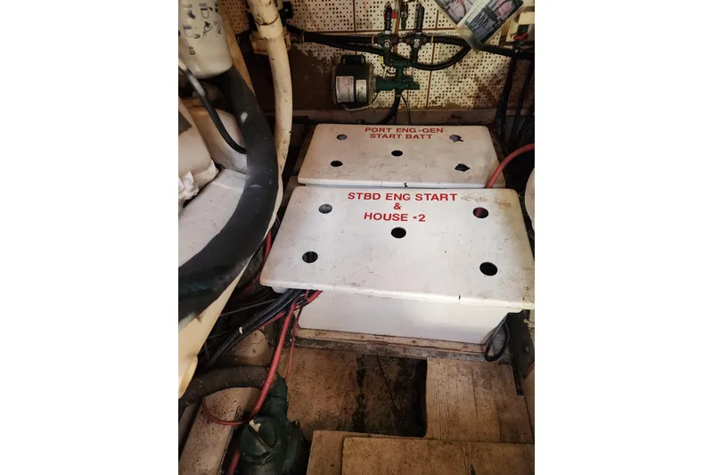 Slide: The Image of Battery compartment of 1987 Jefferson 42 SE Sundeck Motor Yacht, labeled for engine start. - 48