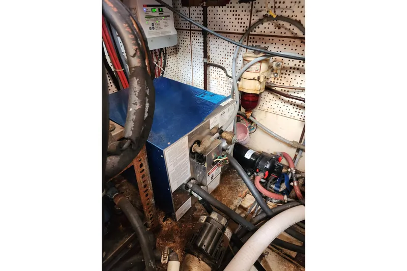 Slide: The Image of Engine room of 1987 Jefferson 42 SE Sundeck Motor Yacht with mechanical components. - 51