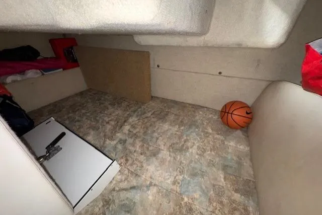 Slide: The Image of 2001 Bayliner 2855 Ciera cabin interior with basketball on floor. - 12
