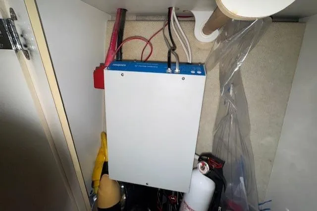 Slide: The Image of Electrical panel inside a 2001 Bayliner 2855 Ciera boat compartment. - 14