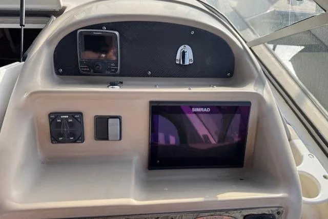 Slide: The Image of Dashboard of a 2001 Bayliner 2855 Ciera boat with Simrad navigation system. - 16
