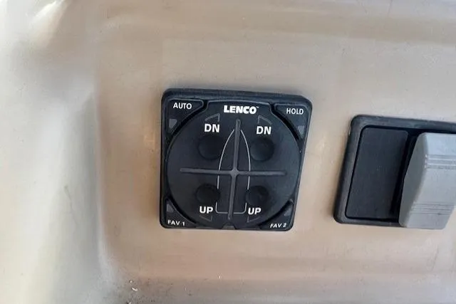 Slide: The Image of Lenco trim tab control panel on 2001 Bayliner 2855 Ciera boat dashboard. - 18