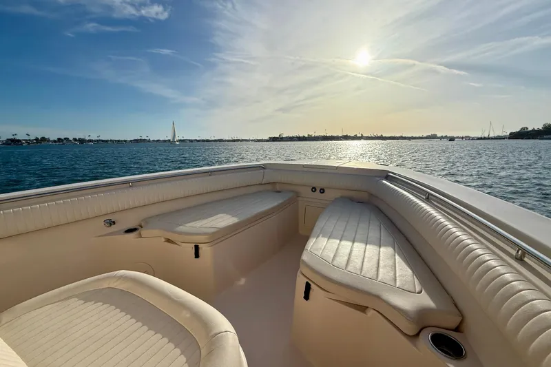 Slide: The Image of 2012 Grady-White Canyon 336 boat interior with sunlit ocean view. - 10