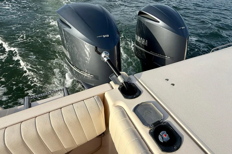 Slide: The Image of 2012 Grady-White Canyon 336 boat with twin Yamaha V8 outboard engines on water. - 26