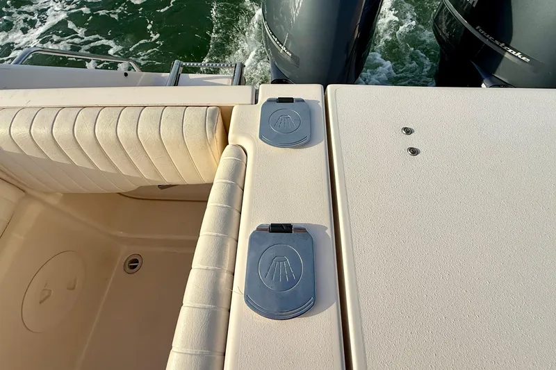 Slide: The Image of 2012 Grady-White Canyon 336 boat deck with twin outboard motors. - 27