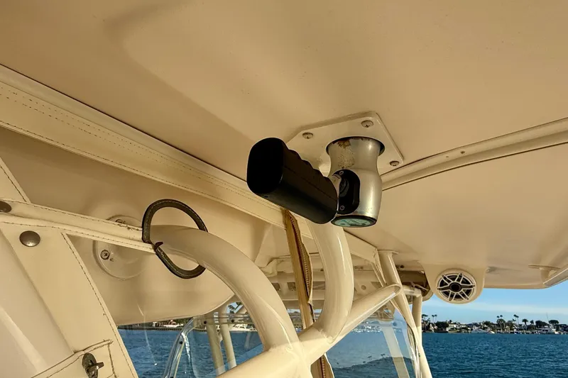 Slide: The Image of 2012 Grady-White Canyon 336 boat interior with mounted equipment and ocean view. - 28