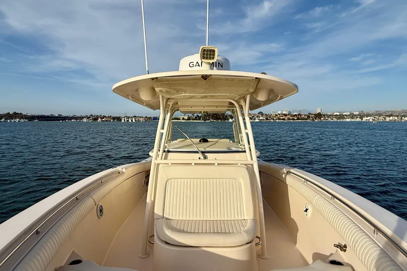 Slide: The Image of 2012 Grady-White Canyon 336 boat on calm water, clear sky background. - 29
