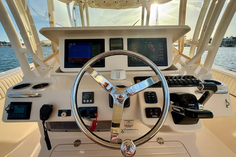 Slide: The Image of Helm of 2012 Grady-White Canyon 336 boat with modern navigation equipment. - 32