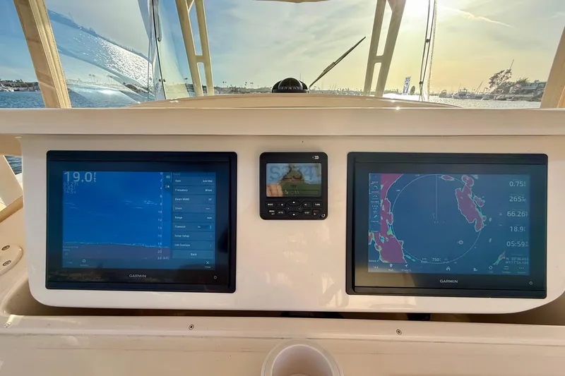 Slide: The Image of Grady-White Canyon 336 boat dashboard with Garmin navigation screens, 2012 model. - 33