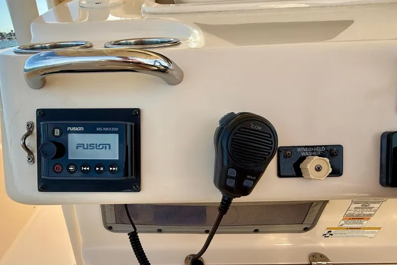 Slide: The Image of Control panel of a 2012 Grady-White Canyon 336 boat with Fusion stereo and Icom microphone. - 34