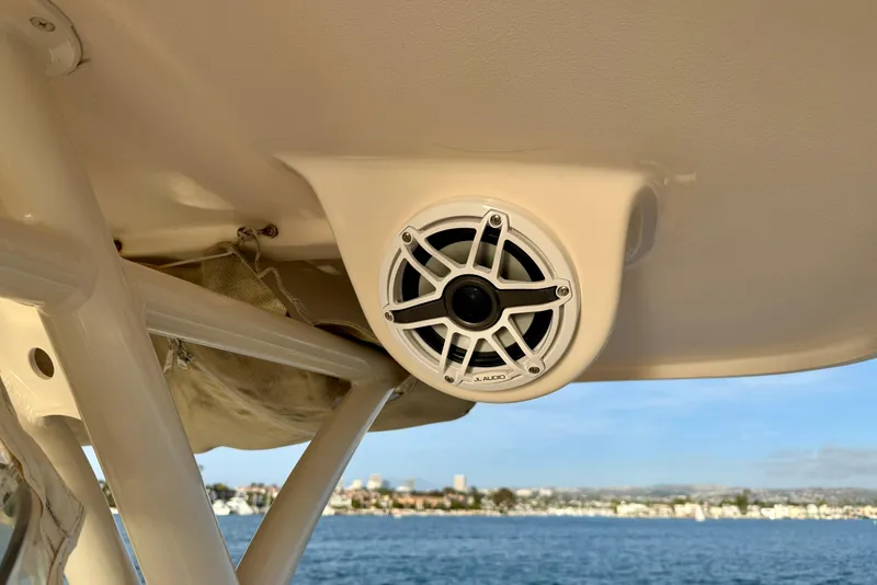 Slide: The Image of JL Audio speaker on 2012 Grady-White Canyon 336 boat, overlooking scenic waterfront. - 45