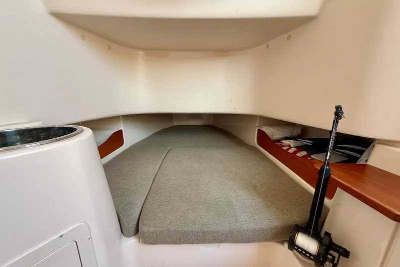 Slide: The Image of 2012 Grady-White Canyon 336 cabin interior with cushioned sleeping area. - 48