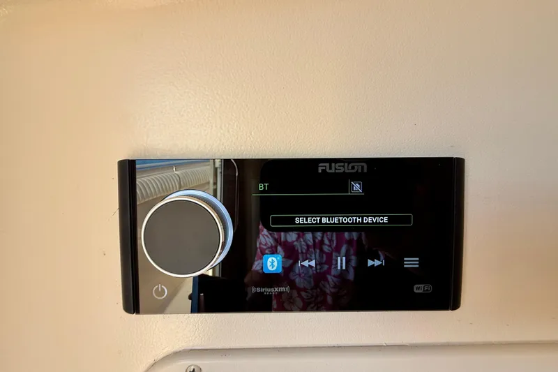 Slide: The Image of Fusion stereo system on 2012 Grady-White Canyon 336 boat, displaying Bluetooth options. - 52