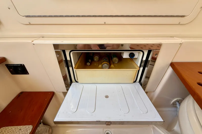 Slide: The Image of Built-in cooler with drinks on a 2012 Grady-White Canyon 336 boat. - 59