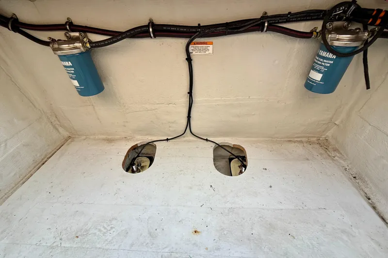 Slide: The Image of 2012 Grady-White Canyon 336 boat interior with Yamaha fuel filters and wiring. - 62