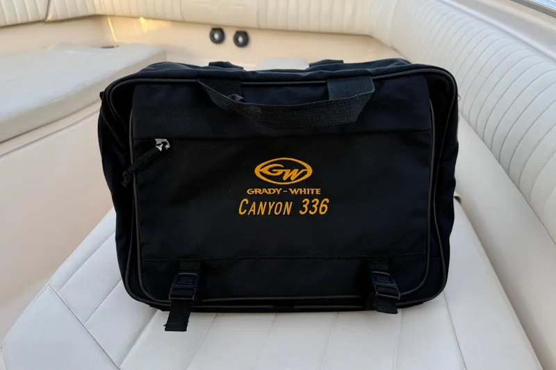 Slide: The Image of Black Grady-White Canyon 336 bag on boat seat, 2012 model. - 64