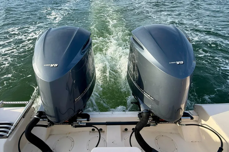 Slide: The Image of Twin Yamaha V8 engines on a 2012 Grady-White Canyon 336 boat in motion. - 65
