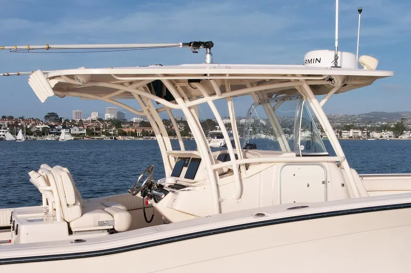 Slide: The Image of 2012 Grady-White Canyon 336 boat on calm waters, featuring sleek design and modern equipment. - 9