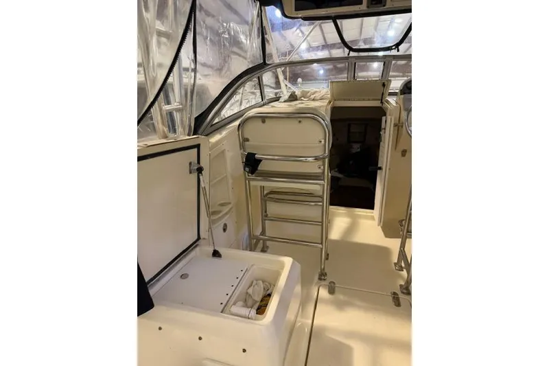 Slide: The Image of Interior view of a 2005 Scout 280 Abaco boat, featuring seating and storage. - 3