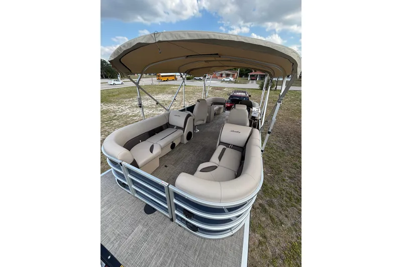 Slide: The Image of 2026 Bentley Pontoons Legacy 223 Navigator with beige interior and sun canopy. - 13
