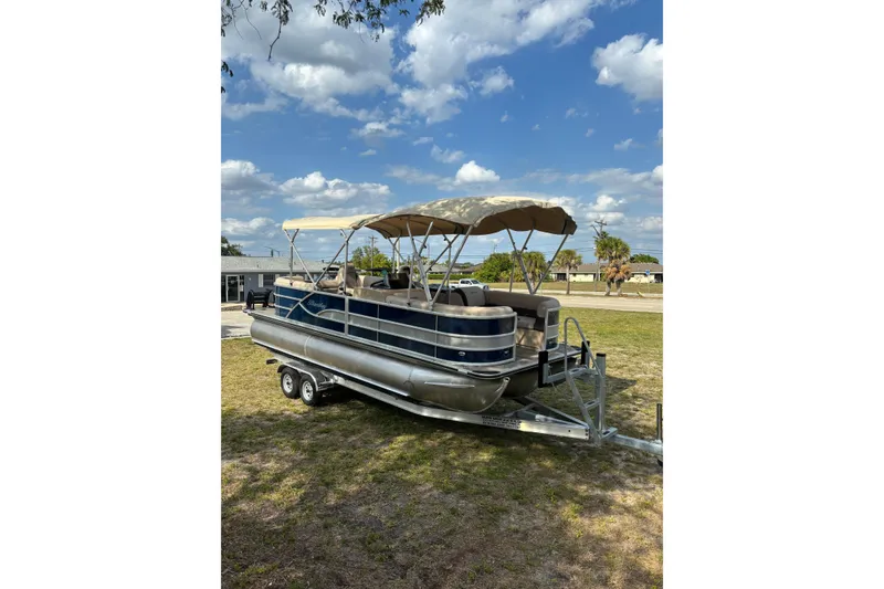 Slide: The Image of 2026 Bentley Pontoons Legacy 223 Navigator on trailer outdoors. - 9