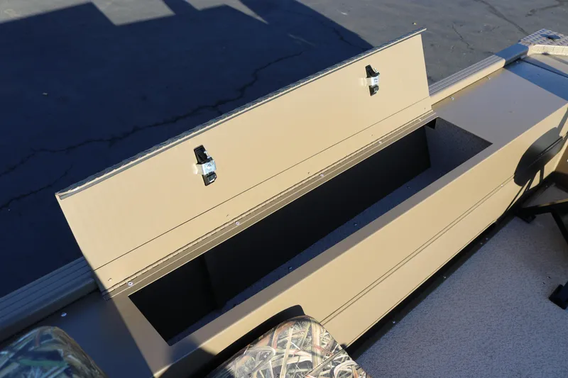 Slide: The Image of 2026 Smoker Craft Pro Sportsman 1866 boat storage compartment with open lid. - 10