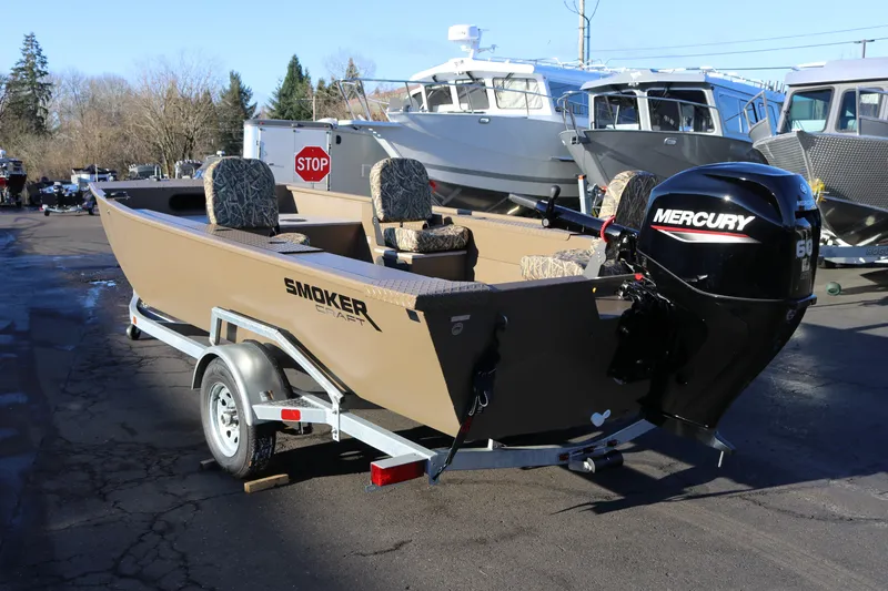 Slide: The Image of 2026 Smoker Craft Pro Sportsman 1866 boat with Mercury engine on trailer. - 19