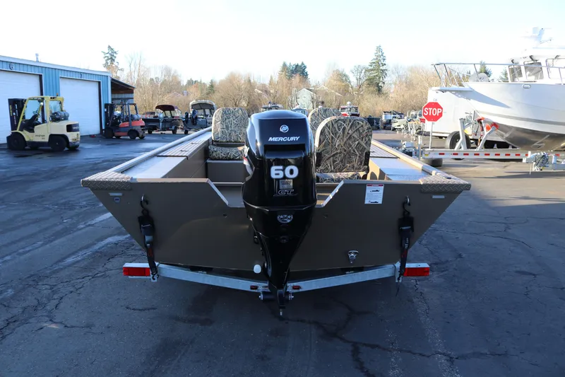 Slide: The Image of 2026 Smoker Craft Pro Sportsman 1866 boat with Mercury 60 engine on trailer. - 2