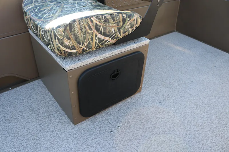 Slide: The Image of Camouflage seat and storage compartment in 2026 Smoker Craft Pro Sportsman 1866 boat. - 6