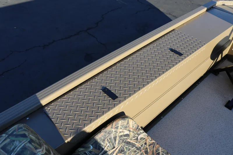 Slide: The Image of 2026 Smoker Craft Pro Sportsman 1866 boat interior with diamond plate flooring. - 9