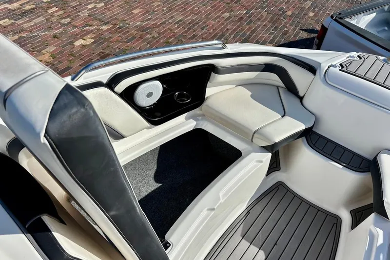 Slide: The Image of 2016 Yamaha Boats AR240 HO interior with seating and speaker, featuring sleek design and comfort. - 29