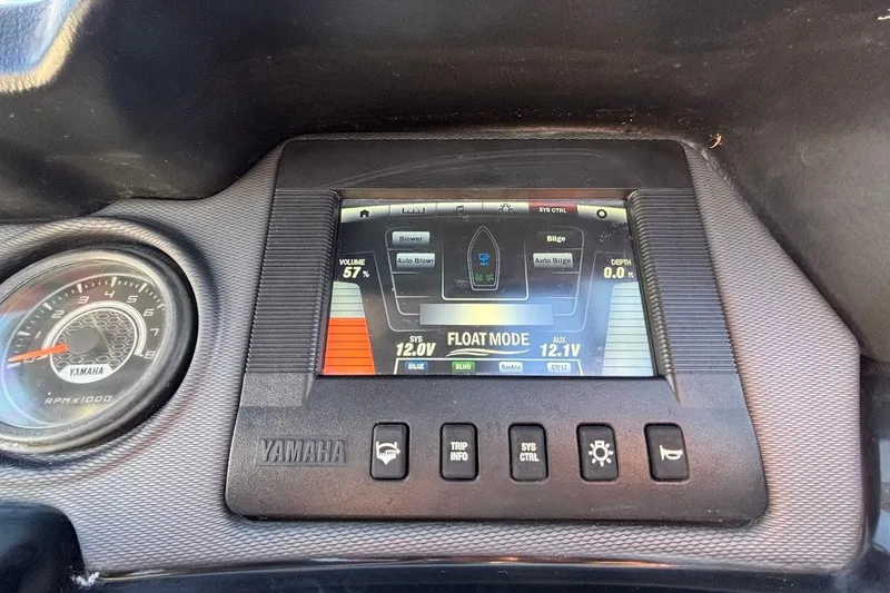 Slide: The Image of Dashboard of a 2016 Yamaha Boats AR240 HO showing controls and display screen. - 30