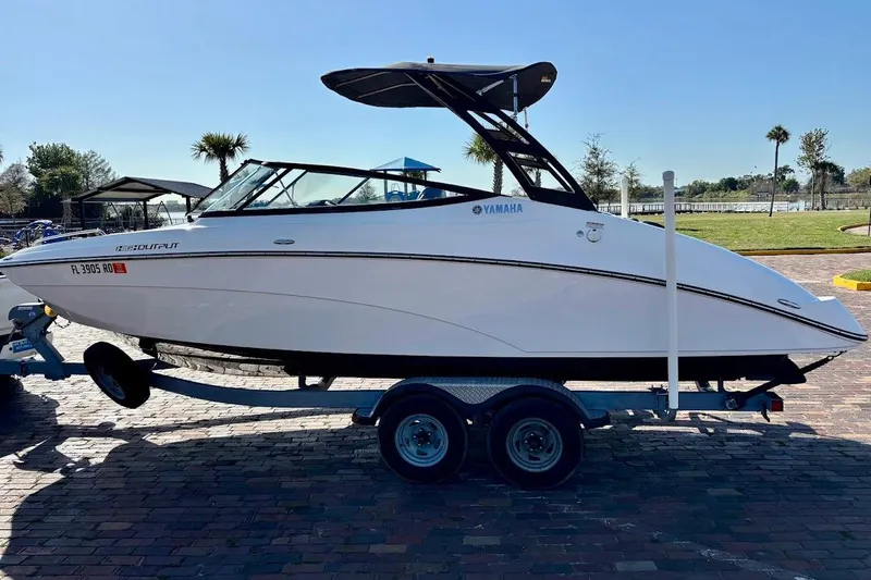 Slide: The Image of 2016 Yamaha Boats AR240 HO on trailer, parked outdoors. - 5