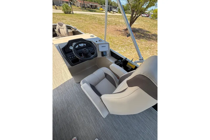 Slide: The Image of Interior view of 2026 Bentley Pontoons Fish 243 4-Point helm. - 23